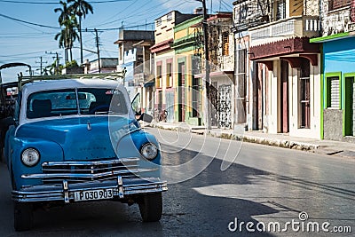 HDR blue american classic car parked on the street in Santa Clara Cuba Editorial Stock Photo