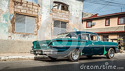 HDR Cuba green american classic car parked for a building Editorial Stock Photo