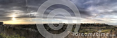 HDR panorama View on the surrounding nature of Mdina city, Malta, and dynamic skies at sunset time Stock Photo