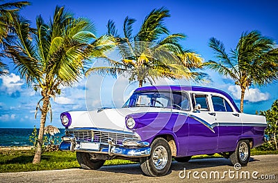 HDR - Parked american white blue vintage car in the front-side view on the beach in Havana Cuba - Serie Cuba Reportage Stock Photo