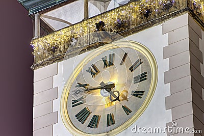 HDR photo of a detail on the Olomouc town hall towers clock at night with christmas decoration Stock Photo