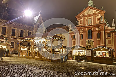 HDR photo of the first ever traditional Christmas markets at the Prague castle behind the Metropolitan Cathedral of Saints Vitus Editorial Stock Photo