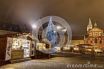 HDR photo of the first ever traditional Christmas markets at the Prague castle behind the Metropolitan Cathedral of Saints Vitus Editorial Stock Photo