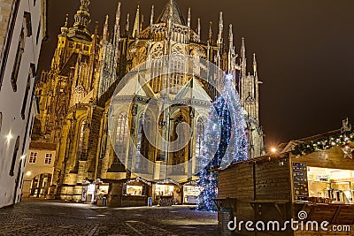 HDR photo of the first ever traditional Christmas markets at the Prague castle behind the Metropolitan Cathedral of Saints Vitus Editorial Stock Photo