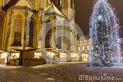 HDR photo of the first ever traditional Christmas markets at the Prague castle behind the Metropolitan Cathedral of Saints Vitus Editorial Stock Photo