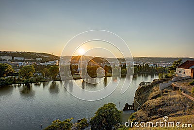 HDR photo of a view on Vltava river with sun setting behind it from Vysehrad in Prague, Czech republic Stock Photo