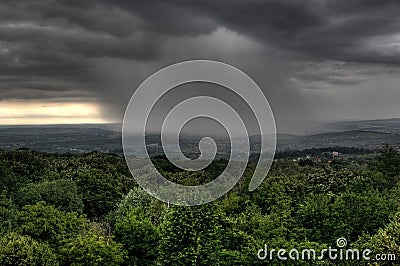 Heavy clouds rain over the city Stock Photo