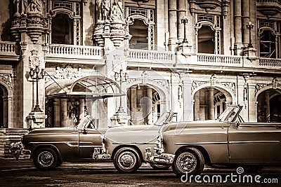 HDR - Street life with parked american convertible vintage cars before the gran teatro in Havana Cub Editorial Stock Photo