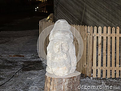 The head is carved from salt on a wooden stand in salt mines in Slanic - Salina Slanic Prahova - in the town of Prahova in Romani Editorial Stock Photo