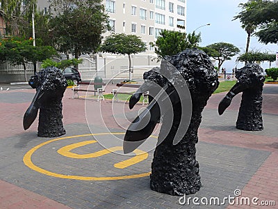 Head and neck of bird black statues in Barranco, Lima Editorial Stock Photo