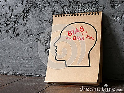 Head on the notebook and words bias. Stock Photo