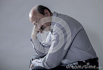 Head portrait of senior mature old man on his 60s looking sad and worried suffering pain and depression in sadness face expression Stock Photo