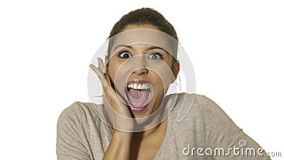 Head portrait of young happy and excited hispanic woman 30s in surprise and astonished face expression eyes and mouth wide open is Stock Photo