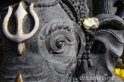 Black Ganesha stone statue headshot Stock Photo