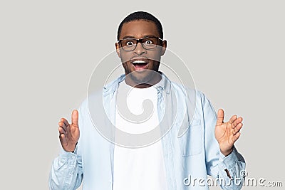 Head shot excited African American man showing big size gesture Stock Photo