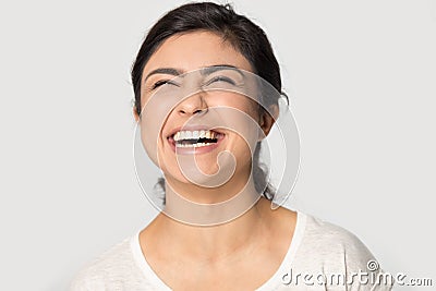 Head shot excited Indian young woman laughing out loud Stock Photo