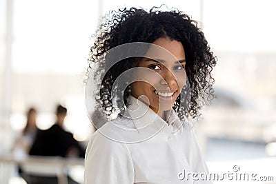 Head shot mixed race successful businesswoman posing looking at camera Stock Photo