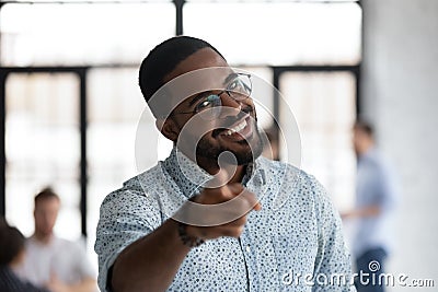 Head shot portrait smiling African American hr manager pointing finger Stock Photo
