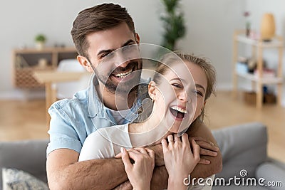 Head shot portrait of happy excited young couple in love at home Stock Photo