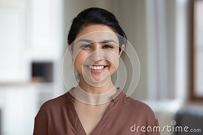 Head shot portrait Indian woman with healthy toothy smile Stock Photo