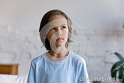 Headshot portrait pensive little boy staring aside looking thoughtful Stock Photo