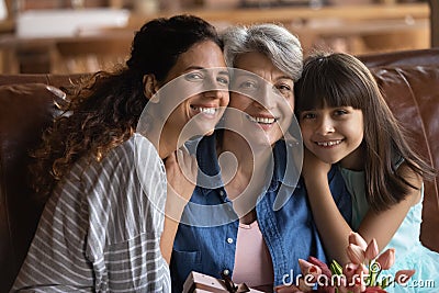 Head shot portrait three generations of women celebrating grandmother birthday Stock Photo