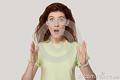 Young surprised woman showing large big size measurement gesture. Stock Photo