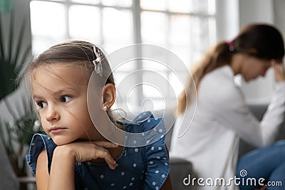 Stressed little unhappy kid girl feeling abused after quarrel. Stock Photo