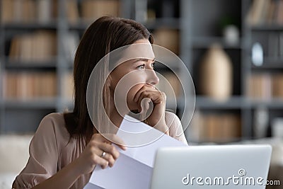 Head shot stressed young woman thinking of financial troubles. Stock Photo