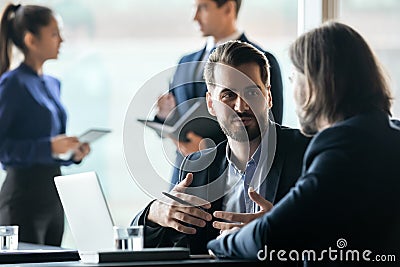 Two male managers discussing project problem solution. Stock Photo