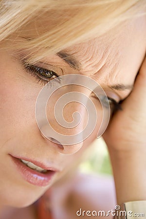 Head shot of woman scowling Stock Photo