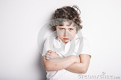 Head and Shoulders Close Up Portrait of Young boy with Sulk attitude Stock Photo