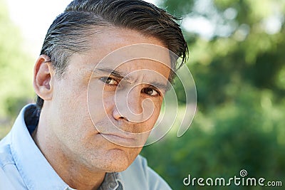 Head And Shoulders Portrait Of Concerned Mature Man Stock Photo