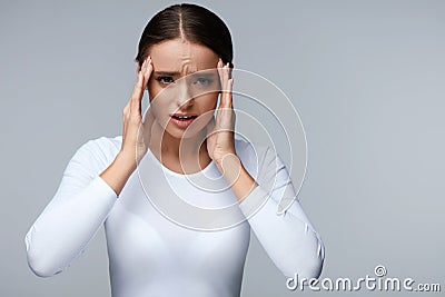 Headache. Beautiful Woman Feeling Stress And Strong Head Pain Stock Photo