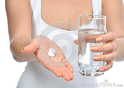 Headache hand with pills medicine tablets and glass of water Stock Photo