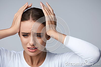 Headache Pain. Beautiful Woman Having Painful Migraine. Health Stock Photo