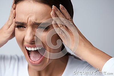 Headache Pain. Beautiful Woman With Painful Migraine, Screaming Stock Photo