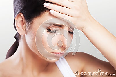 Headache and severe stress. experience. Painful feelings in the head. Fatigue. The concept of health. On a gray background. Stock Photo