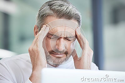 Headache, work stress and burnout of a business man with a 404 computer glitch in a office. Anxiety, head pain and web Stock Photo