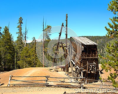 An old abandoned mine sits on top of the mountain Stock Photo