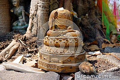 Headless buddha statue in old temple Stock Photo