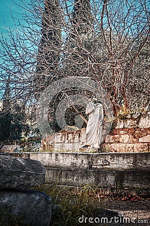 Headless statue on wall of ancient classical Agora of Athens-the center of everyday life in ancient Athens â€“ a place for Stock Photo