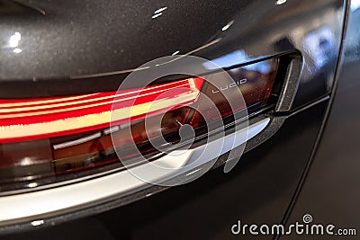 Headlight of black Lucid Air luxury sedan electric vehicle. Editorial Stock Photo