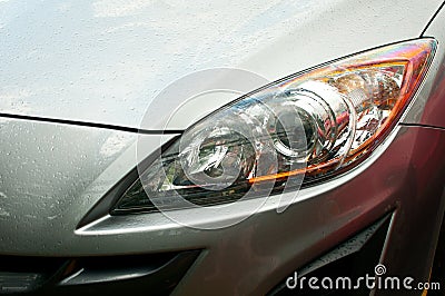 Headlight of grey car Stock Photo