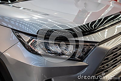 Headlight of grey modern car with LED light Stock Photo