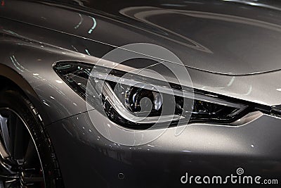 Headlight of grey modern car with LED light Stock Photo