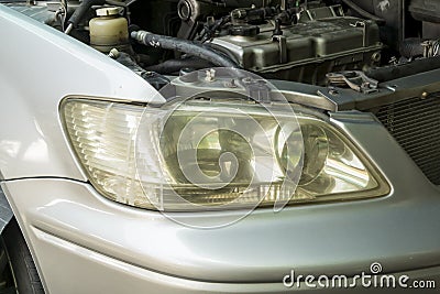 Headlight lenses unpolished cloudy foggy, Car maintenance service Stock Photo