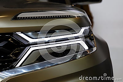 Headlight of modern prestigious car closeup. Car detail. Stock Photo