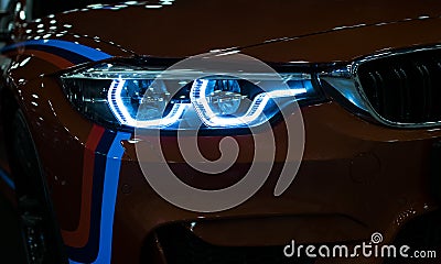 Headlight of a modern sport car.The front lights of the car. Modern Car exterior details. Stock Photo
