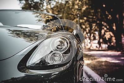 Headlight of a Porsche sports car. Editorial Stock Photo